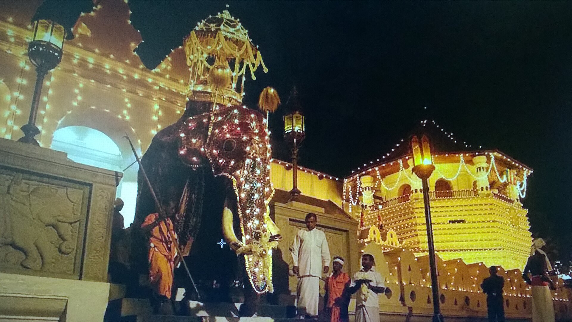 Kandyan dancers and drummers moving through the streets of Kandy