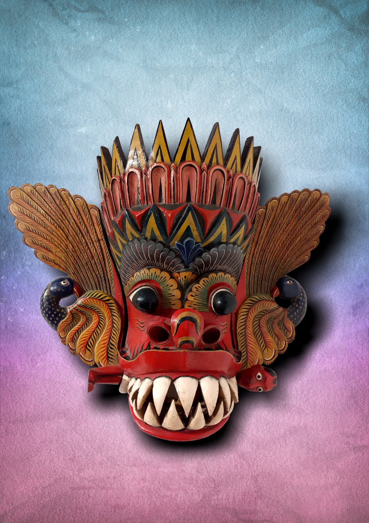 Maru Raksha mask with bared teeth and flame-like ears